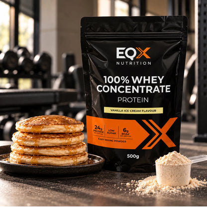EQX 100% Whey Concentrate Vanilla Ice Cream 500 g beside a stack of pancakes and a scoop of protein powder.